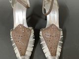 a pair of women ' s shoes on a black surface