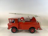a red toy fire truck with a ladder on top of it
