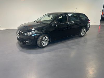 a picture of a black car parked in a garage
