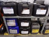 many containers of oil on a shelf in a warehouse