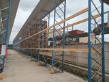 a picture of a long row of scaffolding on the side of a building