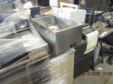 a picture of a machine that is sitting in a warehouse