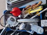 a blue box filled with assorted kitchen utensils