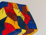 a colorful kite that is flying high in the sky
