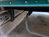 a close up of a truck ' s rear end with a metal bar