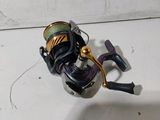 a fishing rod and a reel sitting on a table