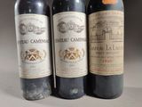 three bottles of wine sitting next to each other on a table
