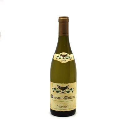 a bottle of wine sitting next to a glass of wine