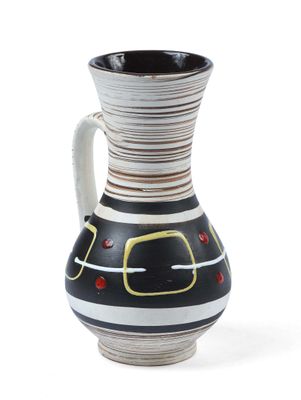 a black and white vase with a yellow and red design on it