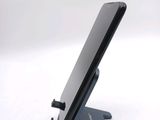 a cell phone that is sitting on a stand
