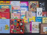 many children ' s books on a black surface
