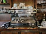 a coffee machine sitting on a counter in a kitchen