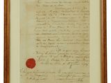 un vieux document portant un cachet de cire rouge