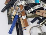 a pile of different types of watches and other watches