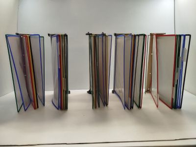 a lot of books that are stacked up on a table