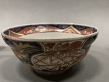 a small bowl and a smaller bowl sitting next to each other