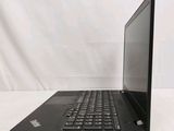 the laptop is open on a white surface with a black keyboard