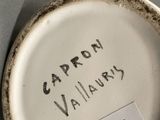 a close up of a plate with a name on it