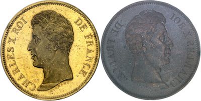two gold sovereigns, one of which has a head of a man and the other of which is a