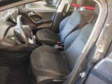 the interior of a car with four seats and a steering wheel