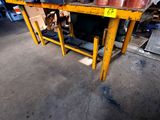a table with pots and pans on it in a warehouse