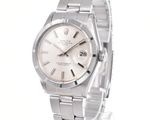 an image of a stainless steel wrist watch with a white dial