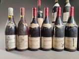several bottles of wine are lined up in a row on a table