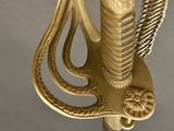 a close up of a sword with a bird on it