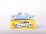 a blue toy car sitting on top of a yellow box