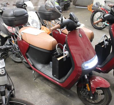 many motorcycles that are parked in a parking lot