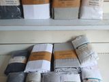 many different types of blankets on a shelf