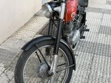 a motorcycle parked on the side of the street