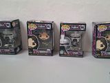 three boxes of funko pop vinyl figures are lined up on a table