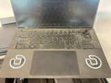 a laptop computer sitting on top of a table