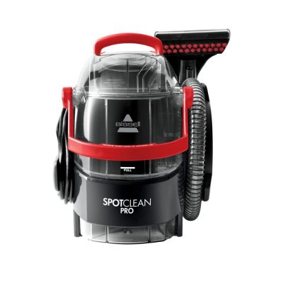 a close up of a black and red vacuum cleaner on a white background