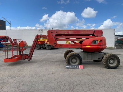 an image of a red scissor parked in a parking lot