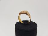 an image of a gold ring sitting on top of a black box