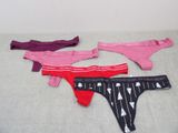 three pairs of underwear sitting on top of a bed next to each other
