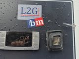 a close up of a parking meter with a sticker on it