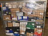 a metal cart with many boxes on it in a warehouse