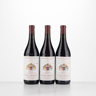 three bottles of wine sitting on top of a table