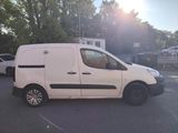 a white van that is parked in a parking lot