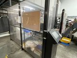 an image of a large glass enclosed area in a warehouse