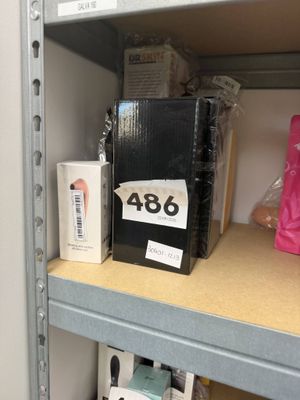a shelf that has a lot of items on it