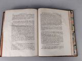 an open book with a picture of a man on it