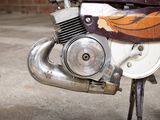 a close up of a motorcycle engine on a street