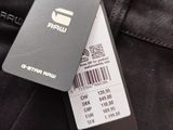 a close up of a tag on a pair of black jeans
