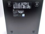 the back of a laptop with a battery on top of it
