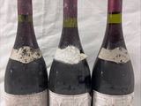three bottles of wine sitting next to each other on a table