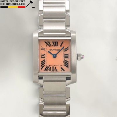 an image of a wrist watch with a pink dial